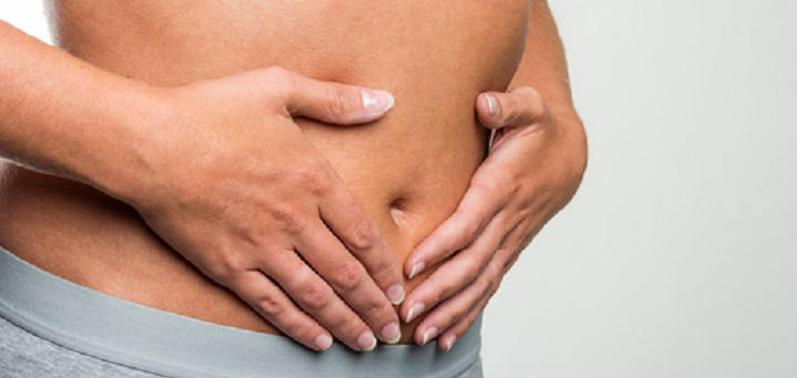 person holding stomach and colon